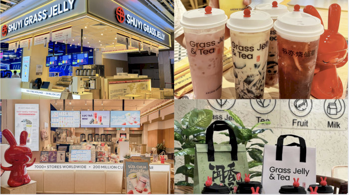 Cửa hàng Shuyi Grass Jelly & Tea Hà Nội với không gian sáng sủa và các loại đồ uống, túi xách in logo.